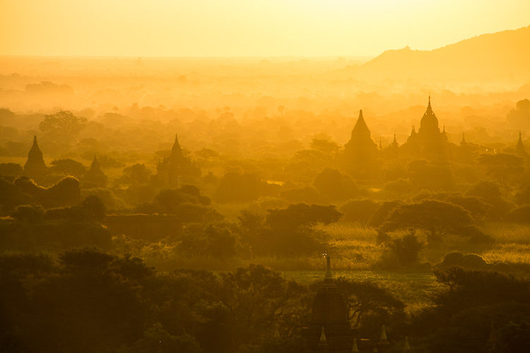 Sunrise over the famous temples and pagodas showing the golden light of Myanmar
