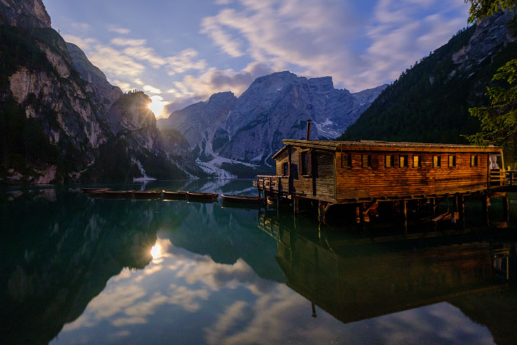 Braies mountain cabin lit by moonlight