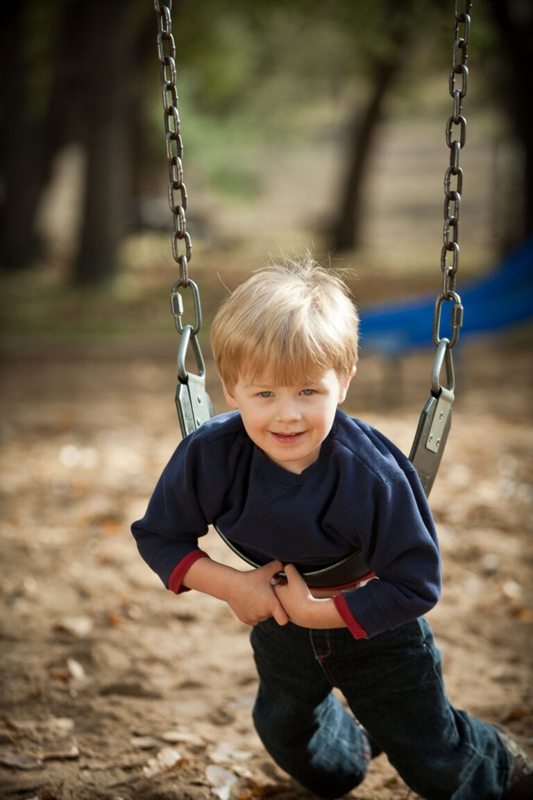 compare this long lens photo of the child on the swing with the wide angle lens previously to spot the difference camera lenses make