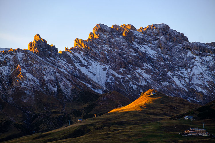 Sun hitting the top of Catinaccio Rosengarten mountain