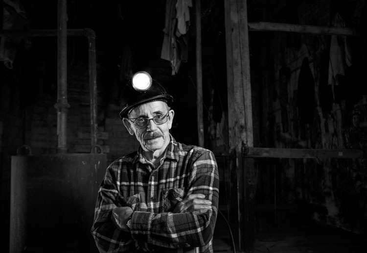 luminar split toning example before photo of a coal miner