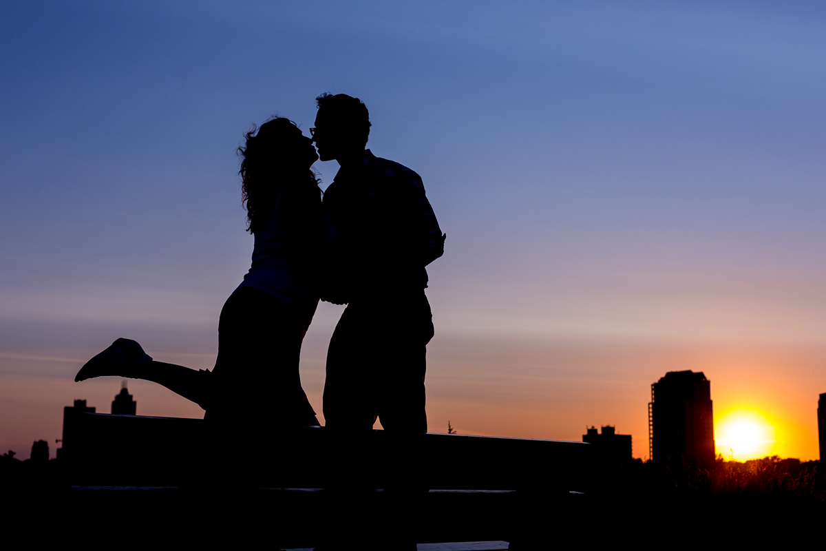 couple kissing at sunset or blue hour before bokeh applied