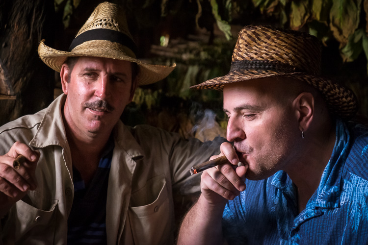 a second photo of the cigar smoking men with shadows left in for creative depth