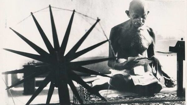 famous photographer Margaret Bourke-White's iconic photo of Ghandi spinning wool taken in 1946