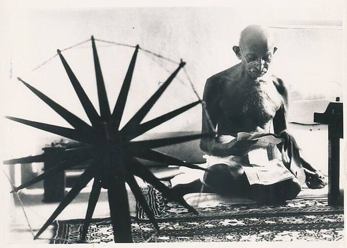 famous photographer Margaret Bourke-White's iconic photo of Ghandi spinning wool taken in 1946