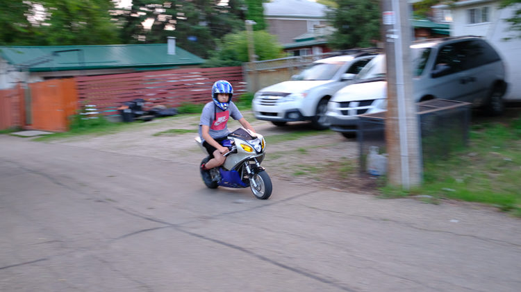 example image of a slow shutter speed and burst mode allowing panning of a motorcycle in motion