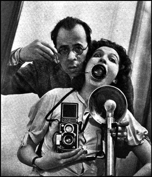 self portrait of Philippe and Yvonne Halsman in a mirror showing camera and flash