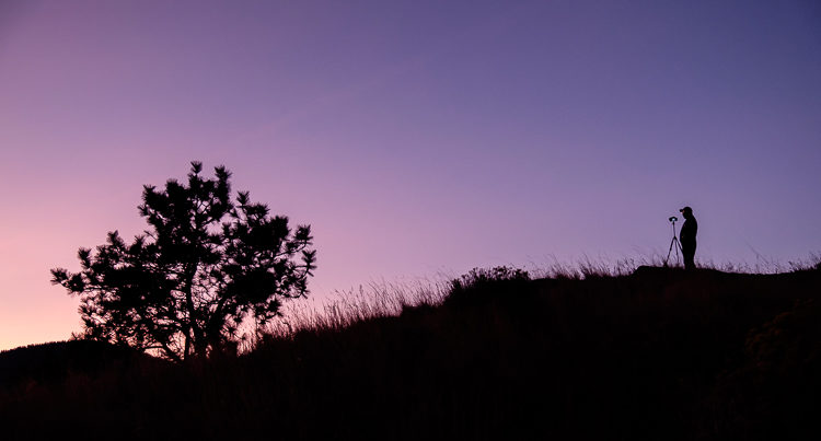 Blue hour silhouette of photographer with minimal shadow detail