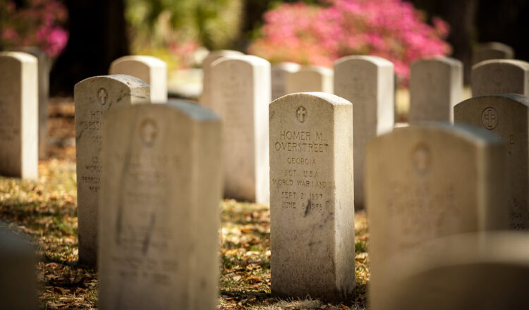 using long camera lenses can create a feeling of isolation like this headstone, which appears isolated from the others
