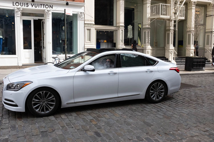 photo of a man in car smoking before being cropped and edited