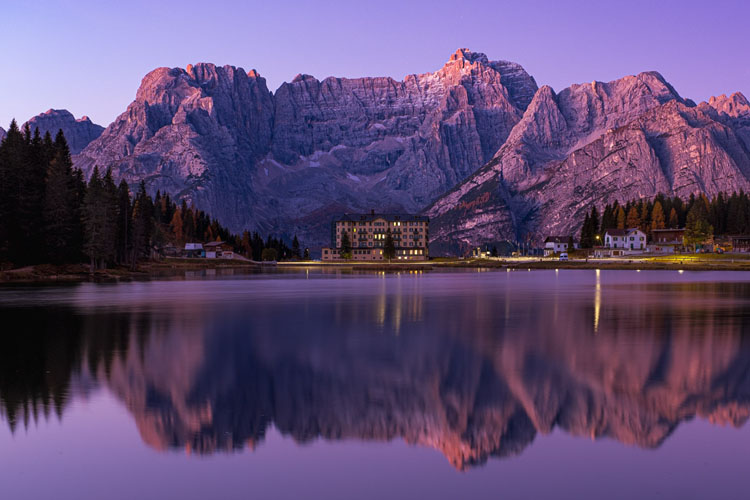 Misurina mountains with reflection in the water before it