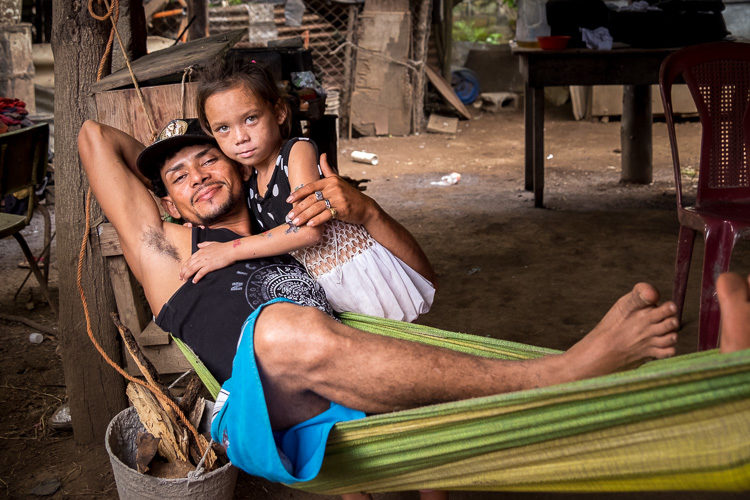 a father and his daughter in a hammock in Nicaragua. Taken during a photography vacation