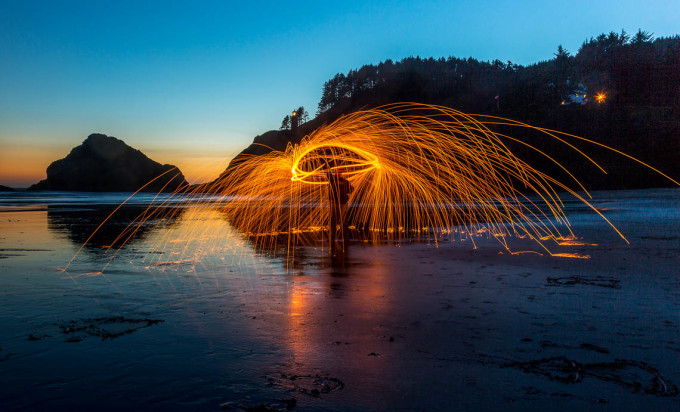 Fire spinning on the beach