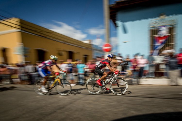 bicylists in Trinidad Cuba are shown with blurred background as an example of panning