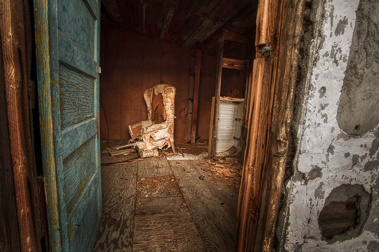 Photo of an abandoned room with chair providing example of depth of field