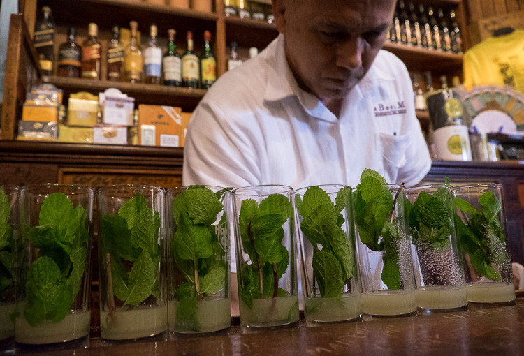 Street photograph of a bartender mixing drinks in Havana Cuba
