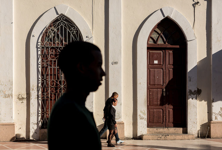 I was trying to capture the school kids between the windows and got this giant silhouette also. I decided it was a happy accident as it really works for the composition.