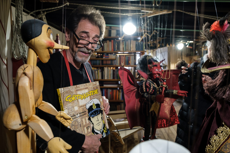 Puppet maker Roberto Comin with his puppets in his shop