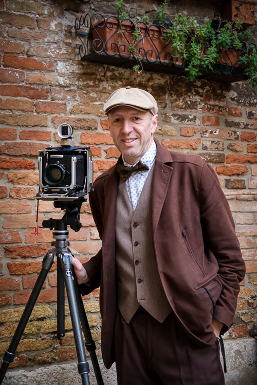 Ugo Cei with antique camera on tripod at venice carnival