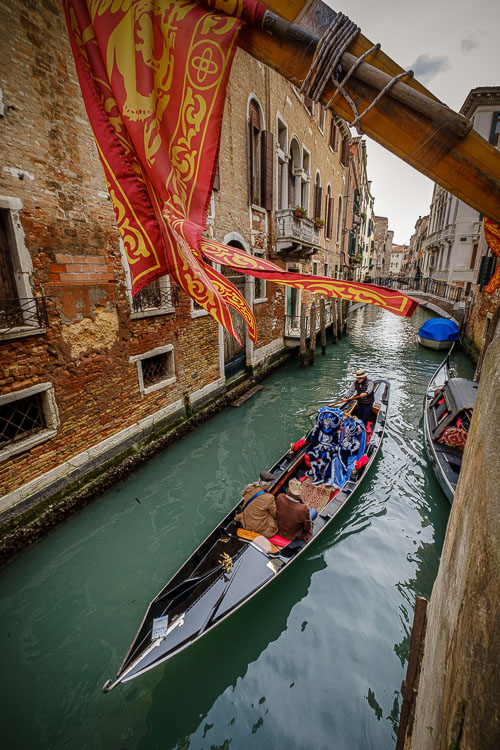 Gondola passes by in Venice canal