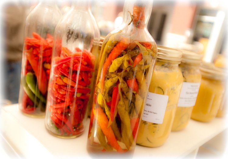Bottles of dried peppers and canned vegetables at the market make for a colorful photo