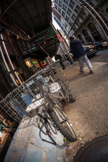 bicycle on the street photographed with a 50mm lens making everything look like their equal distances from the camera