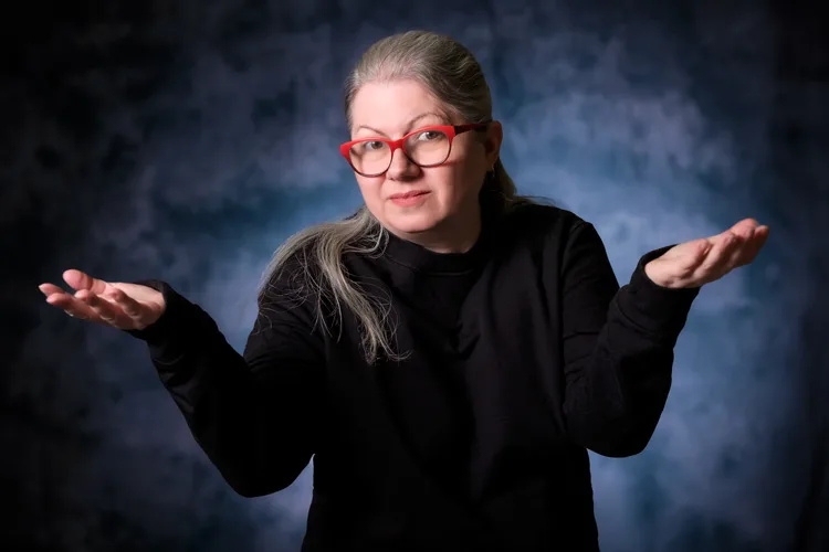 Blue background for the headshot